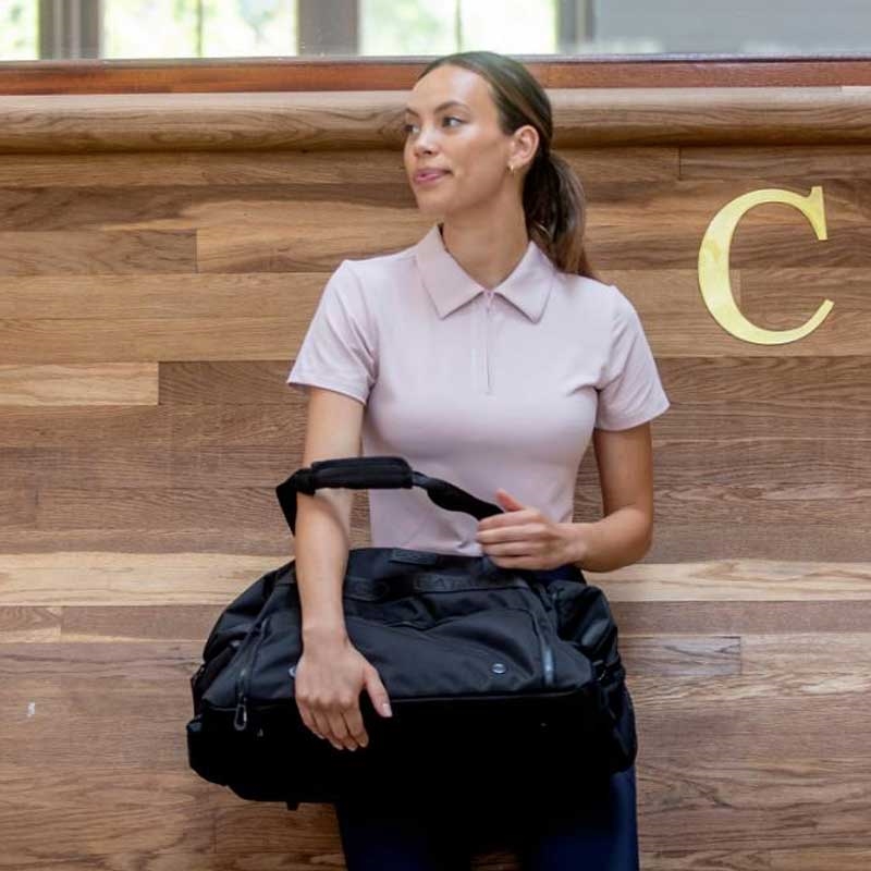 Catago "Nash" zip polo top - Burnished lilac på rytter ved ridebane
